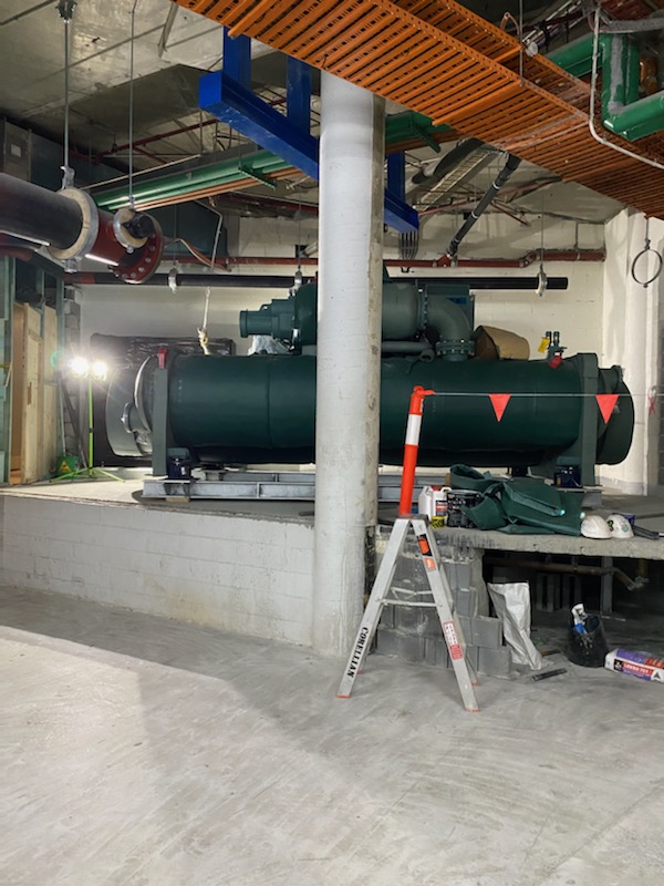 Chiller positioned under monorail
