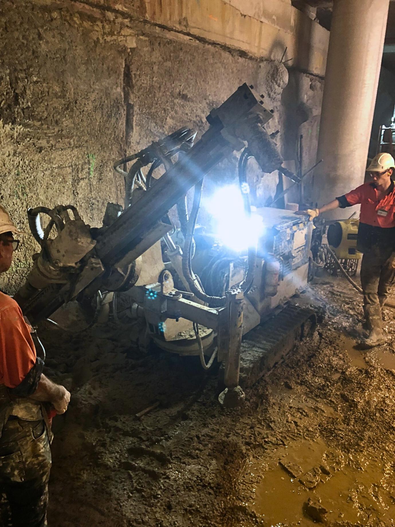 Rock anchors are drilled into the stone to shore up the wall