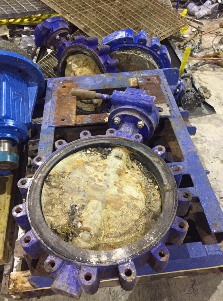 Demolished plant is disassembled, cut apart and removed from site