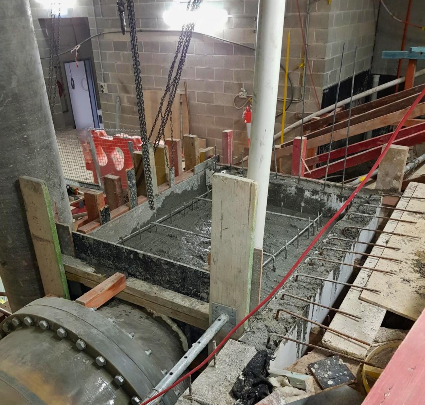 Reinforced concrete is prepared and poured throughout the site